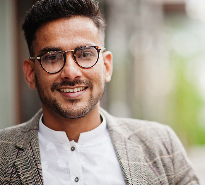 Young Pakistani professional looking hopeful about the future, eager to kickstart his Accounting career with Australia's leading Professional Year program with Performance Education.